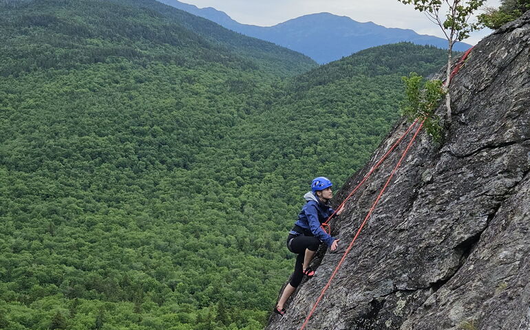 person hiking as part of UNE program.