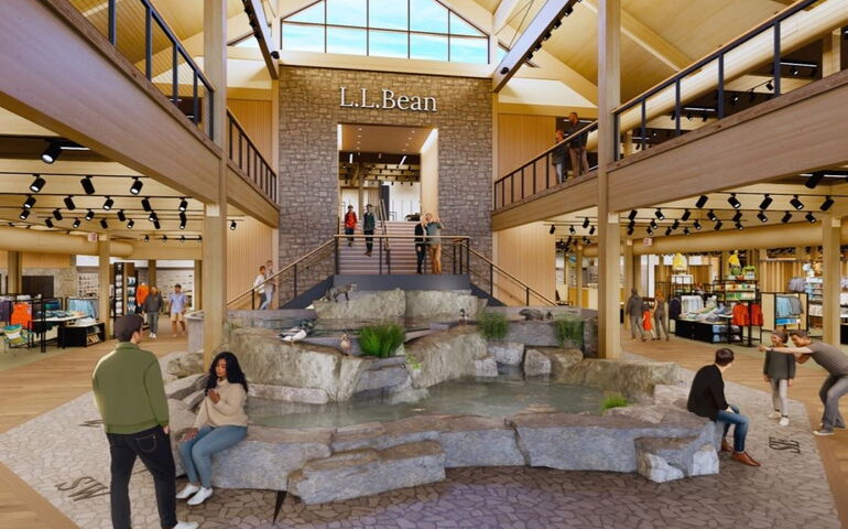 An interior view shows high ceilings and a water feature.