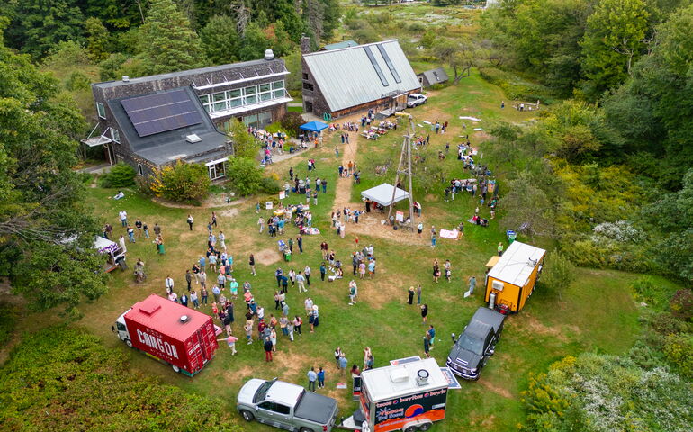 An aerial view shows people at a festival.