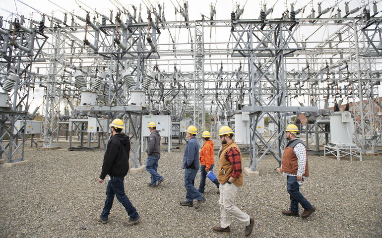 Versant safety inspection workers at a site.